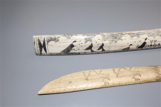 An eskimo scrimshaw elk bone and a similar paper knife,